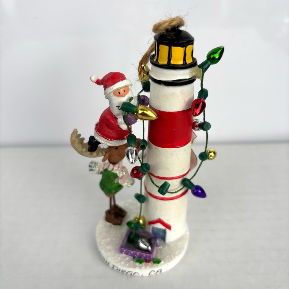 Santa & Moose Decorating a Lighthouse Christmas Ornament Julia Oliver Cape Shore
